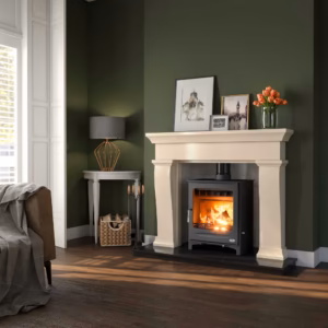 Valley Ivory Pearl fireplace shown in a living room setting with a Henley Sherwood stove and black granite hearth.