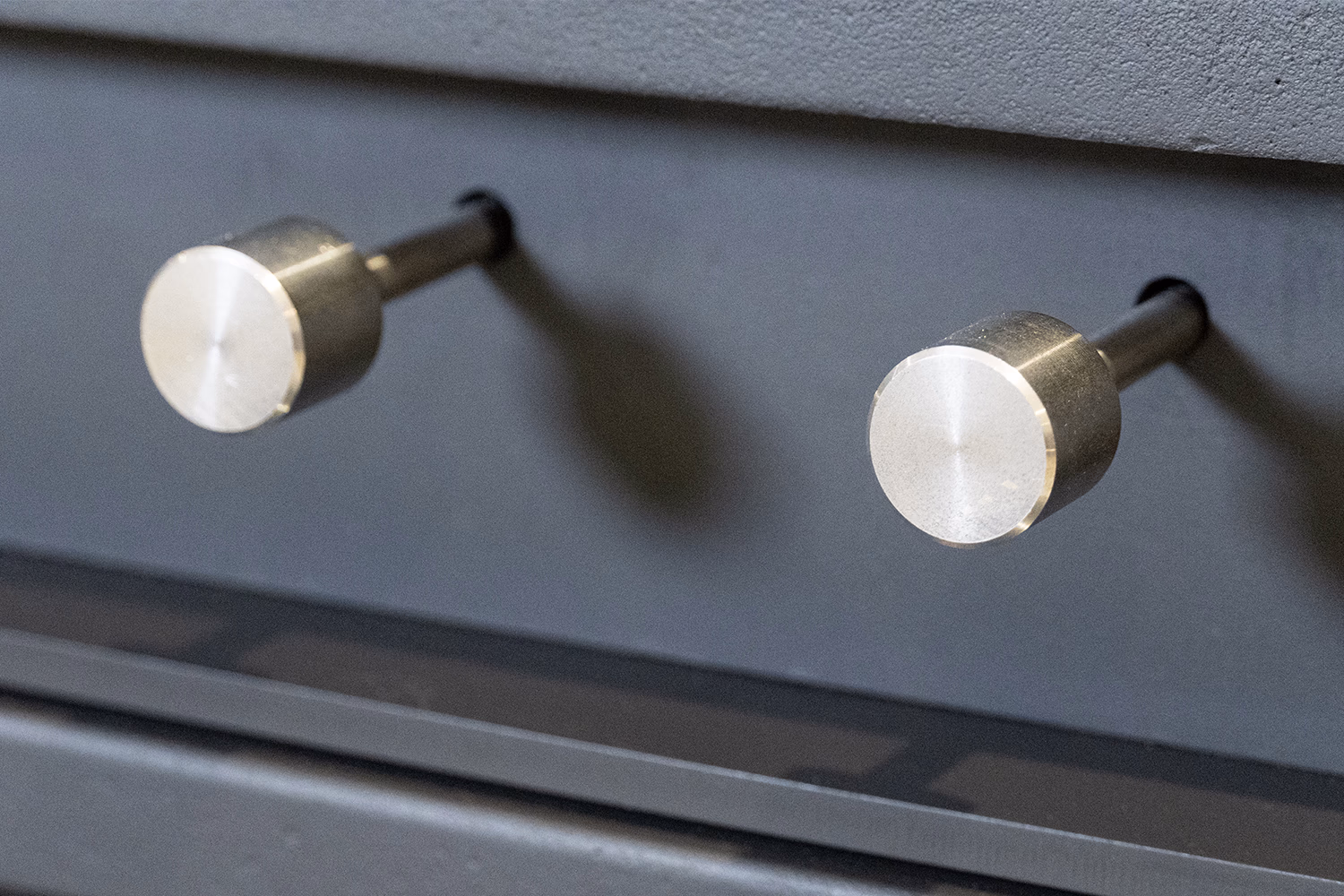 Close-up detail of the Burnbright stove pull handles