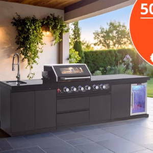Black modular outdoor kitchen with BBQ, sink and fridge in a garden patio setting.