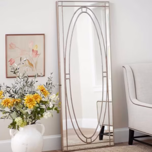 Antique gold full length floor mirror styled in a living room setting.