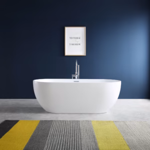 White freestanding Bali bath with chrome tap against a dark blue bathroom wall.