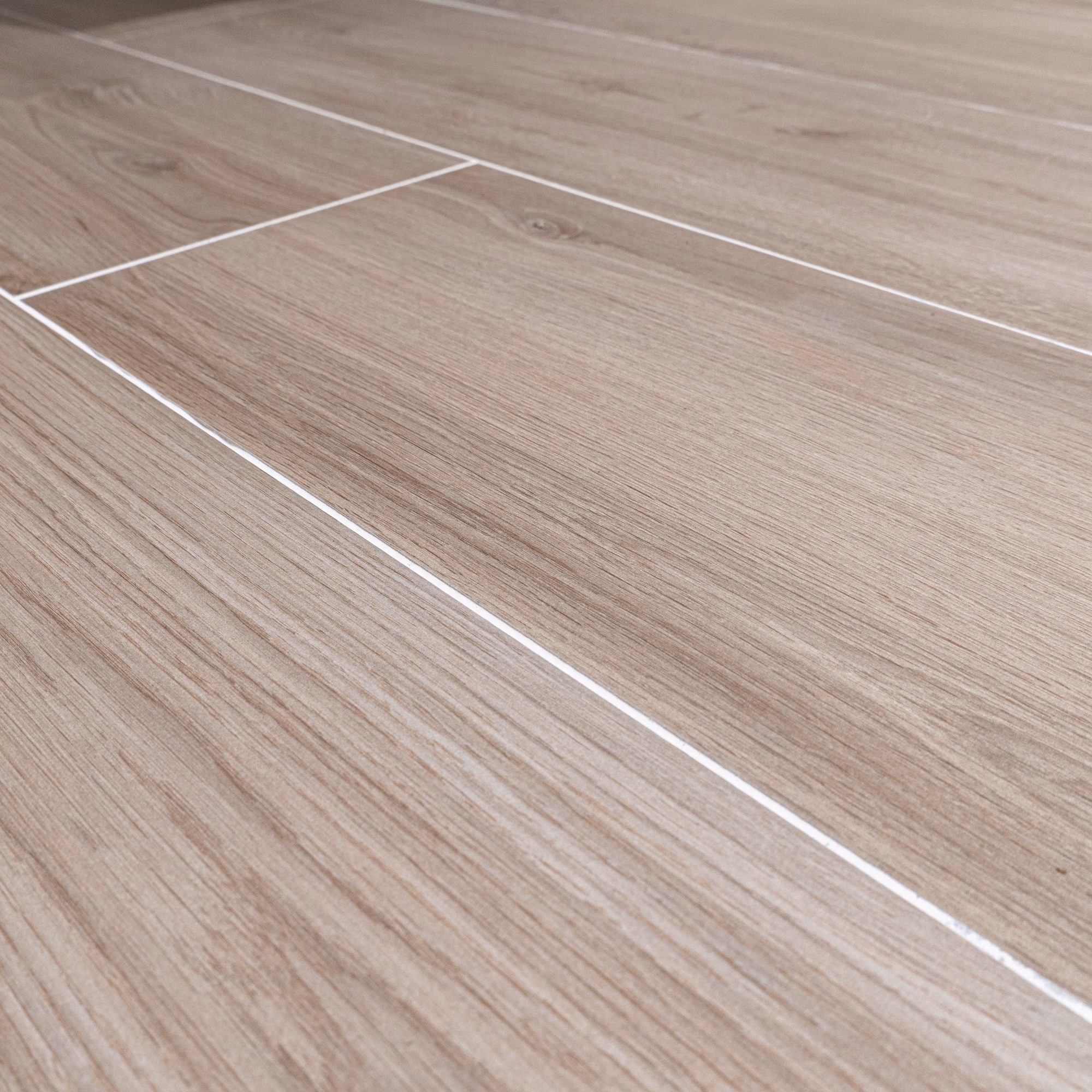 Close-up detail of Lagom Natural 26x160 natural wood-effect floor tile
