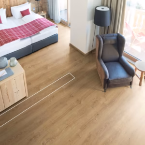 Natural Bayford Oak Aqua laminate flooring shown in a bedroom and lounge room setting.