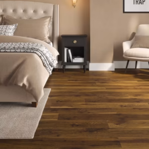 Smoked Cathedral Oak laminate flooring shown in a bedroom setting.