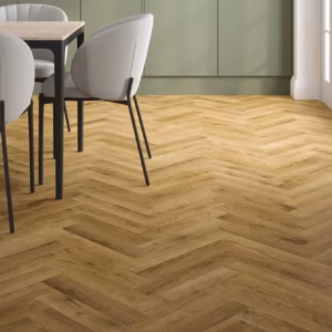 Stade Oak Herringbone laminate flooring shown in a bright dining room setting.